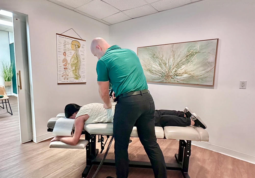 Jason Barker Adjusting A Patient HP Mobile